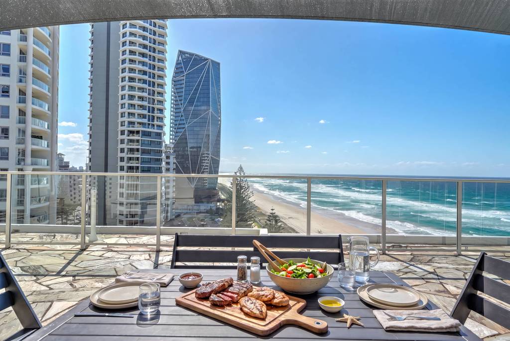 Rooftop dining table overlooking the Gold Coast beach and high-rises